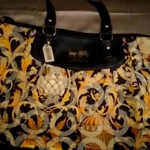Coach vintage tote in black and golden yellow baroque pattern